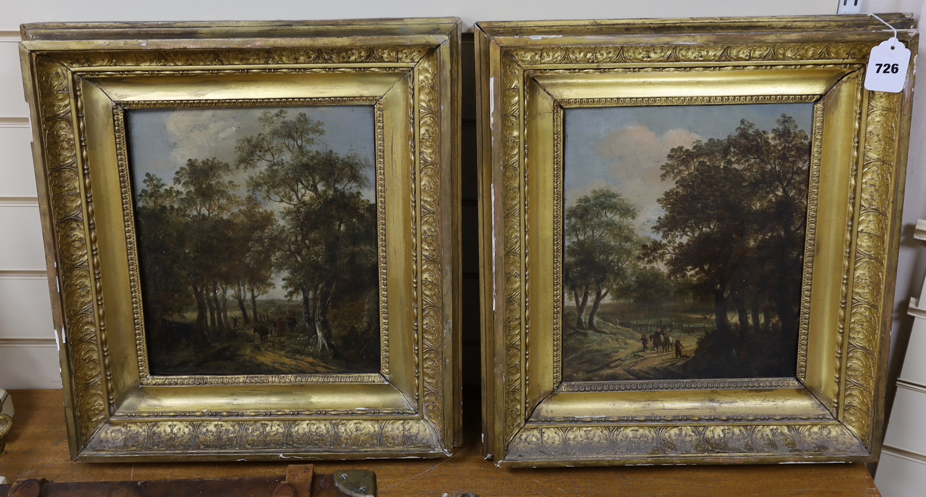 Early 19th century Continental School, pair of oils on canvas, Travellers on woodland tracks, 32 x 27cm
